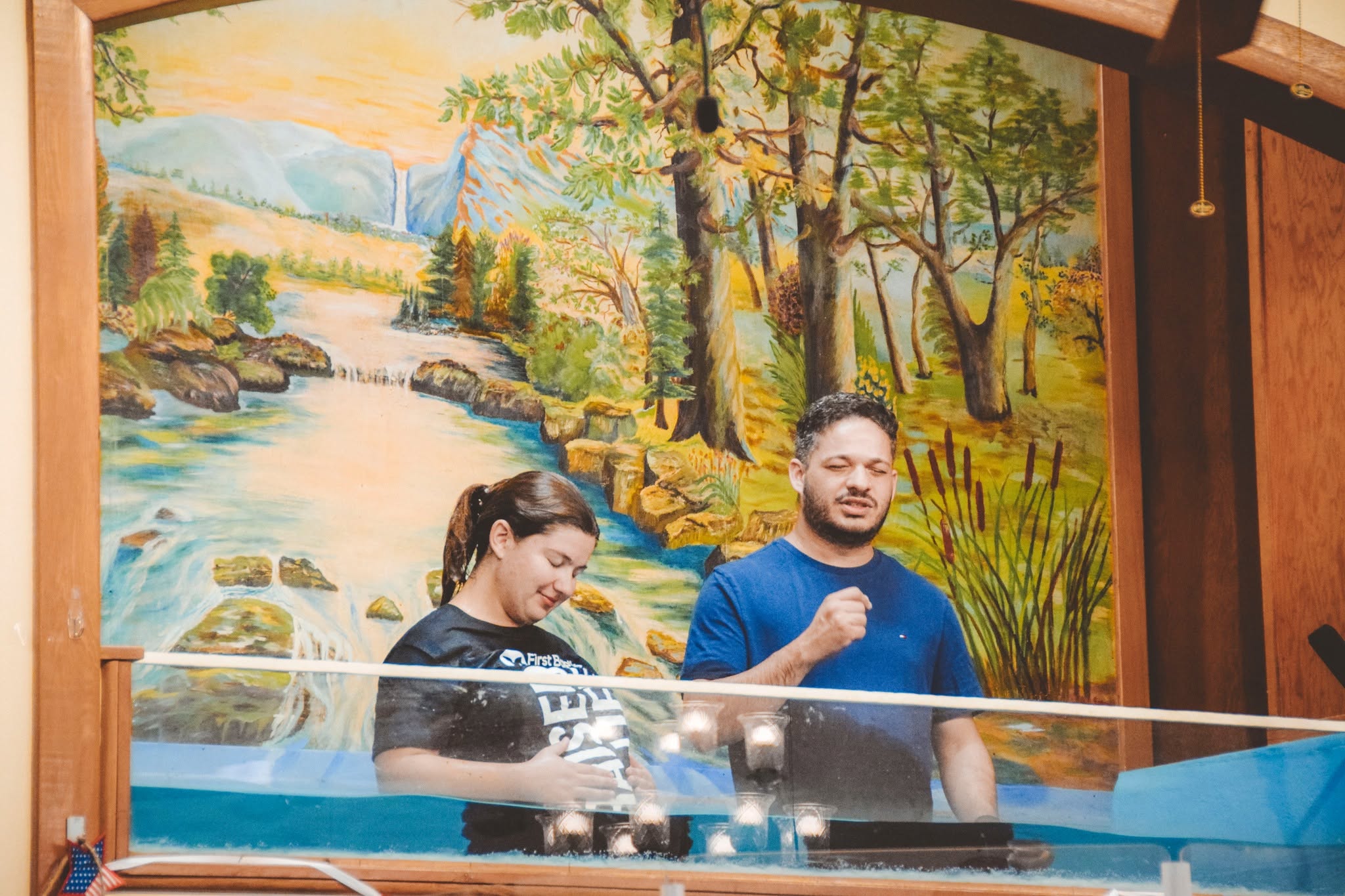 A pastor leading prayer during a baptism at FBC Gordon